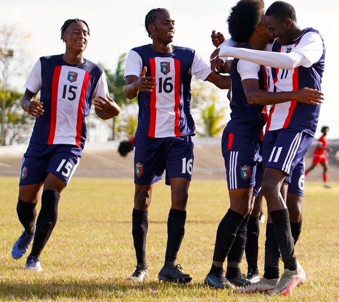Caledonia AIA players celebrate after scoring on Cunupia FC