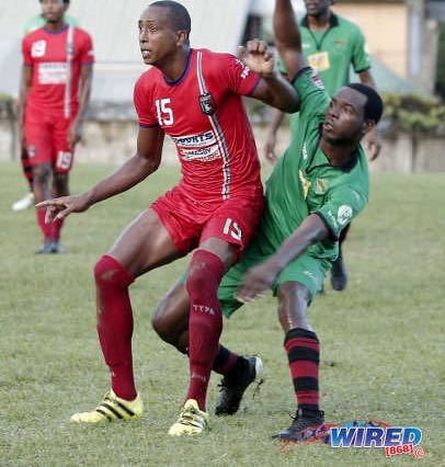 Photo: Morvant Caledonia AIA attacker Johnny Noreiga-Brito (left) awaits a pass while San Juan Jabloteh player Delon Jagassar during Ascension Invitational action at Bourg Mulatresse on 28 July 2019. (Copyright Annalicia Caruth/Wired868)