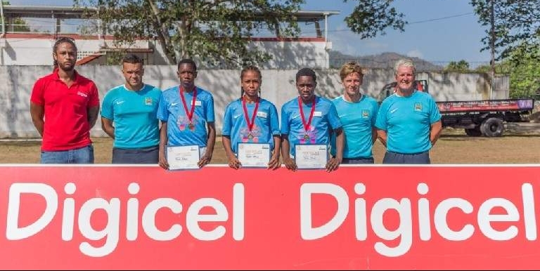 TOP THREE: The top three players who were selected from the clinic to represent Trinidad and Tobago, Trevis Byron, third from left, Judah Garcia, centre, and Jodel Brown, third from right. —Photo courtesy Digicel