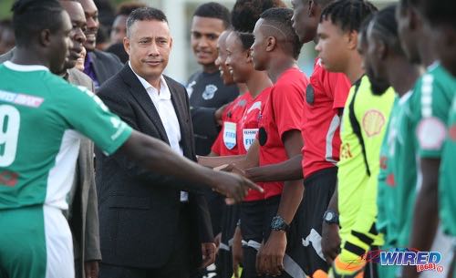 Photo: Commissioner of Police Gary Griffith (centre) meets the San Juan North Secondary players before kickoff of the National Intercol final at the Ato Boldon Stadium on 4 December 2018. (Copyright Allan V Crane/CA-Images/Wired868)