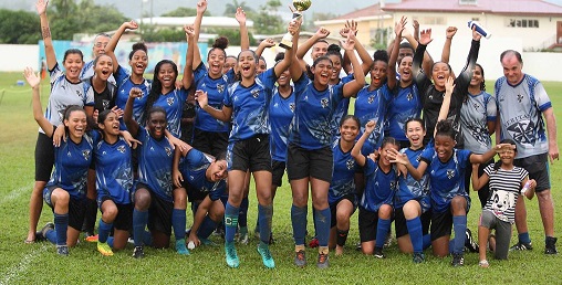 Havana Ramdeen, fifth from left, the captain and Britanny Mahabir, fifth from right at front celebrate with their Holy Name Convent Port-of-Spain team-mates the 2019 Coca Cola Girl’s North Zone title after their 7-2 victory over Bishops Anstey on Sunday at St Mary’s Ground, Port-of-Spain. ...ANTHONY HARRIS
