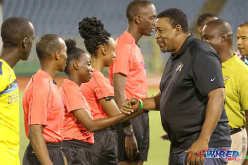 Photo: TTFA president David John-Williams (right) smiles with fourth official Cecile Hinds before the First Citizens Bank Cup final between Defence Force and Ma Pau Stars at the Hasely Crawford Stadium on 2 December 2016. (Courtesy Sean Morrison/Wired868)