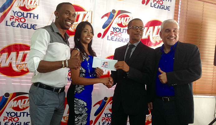 (Left to right) International cricket star Dwayne Bravo, Michelle Mungal, brand manager - soft drinks division - Malta Carib, TT Pro League CEO Dexter Skeene and Collin Murray, sponsorship and events manager at Malta Carib pictured during the launch of the Malta Carib Youth Pro League 2015 at the President’s Box of the Queens Park Oval in Port of Spain on March 20, 2015.