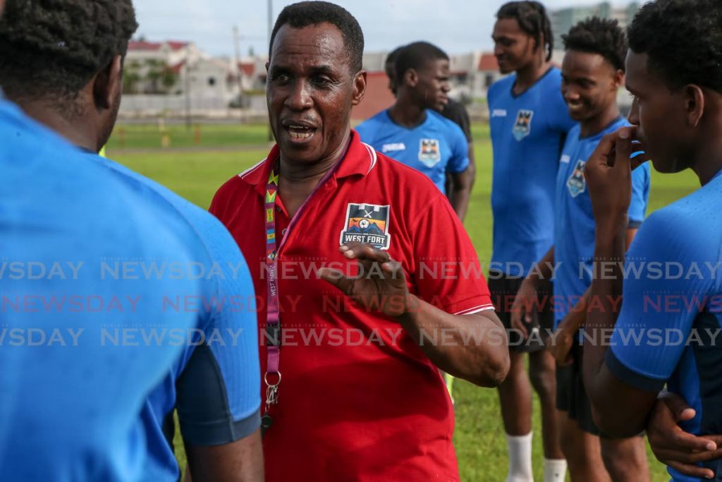 Real West Fort United owner/coach Ron La Forest (centre) talks to his players during a training session at the Corporate Ground, Westmoorings on Saturday. PHOTO BY JEFF MAYERS. - Jeff Mayers