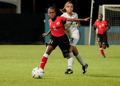Miakayla St Clair (on ball) of T&T holds off Cuba’s Cinthia Canoto to keep the ball during their CFU Girls' Under-14 match in the Challenge Series at the Ato Boldon Stadium in Couva on Tuesday. Cuba won 2-1. ...Daniel Prentice/CA-images