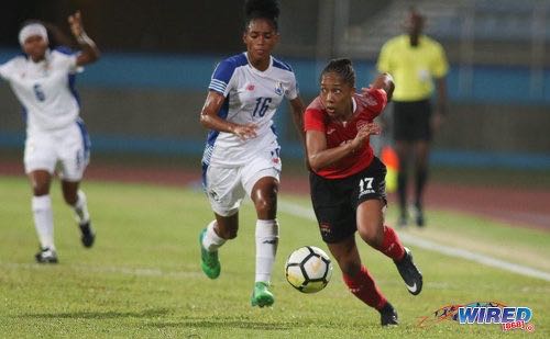 Photo: Trinidad and Tobago forward Andrea Young (right) looks to peel away from Panama right-back Katherine Castillo during international friendly action at the Ato Boldon Stadium on 22 March, 2018. Panama won 2-1. ...(Copyright Chevaughn Christopher/Wired868)