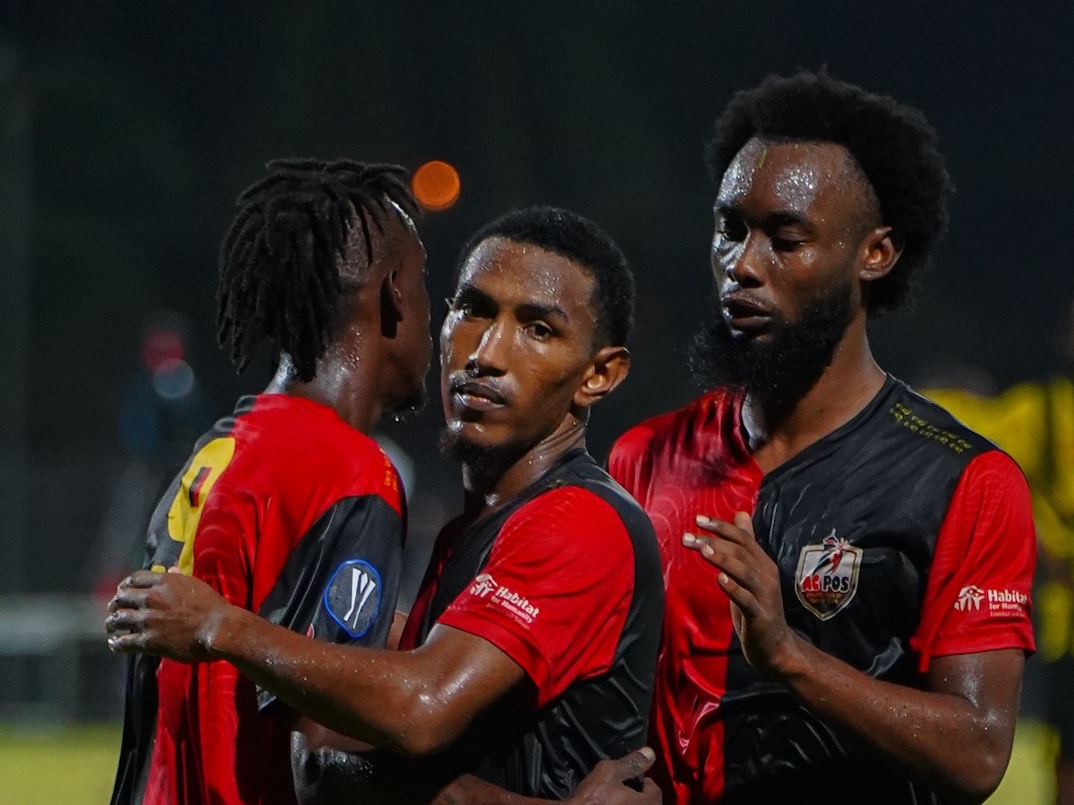 AC Port of Spain's Kadeem Corbin (left) is congratulated by John-Paul Rochford (center) after scoring a goal against Central FC AT THE Diego Martin Sporting Complex on Wednesday, December 20th 2023.