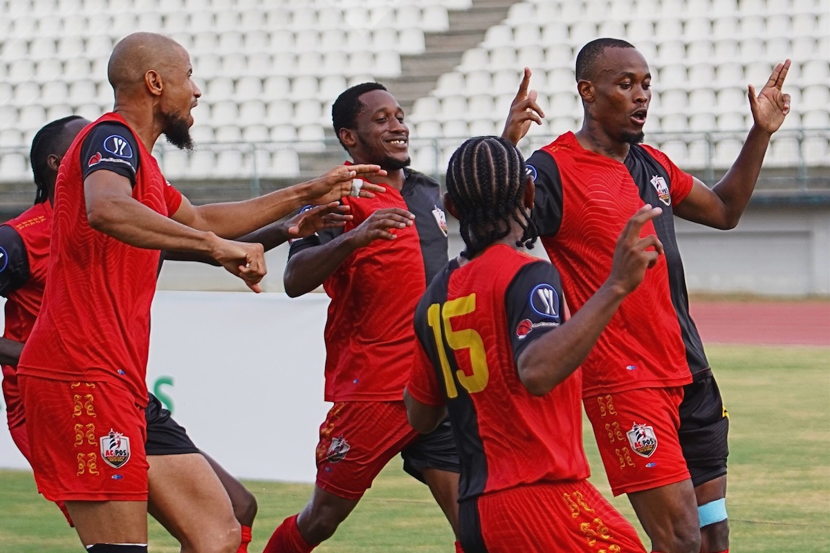 AC Port of Spain's Jamal Charles (right) celebrates with teammates after scoring against Club Sando during their T&T Premier Football League match at Larry Gomes Stadium, Malabar on Saturday, May 11th 2024.