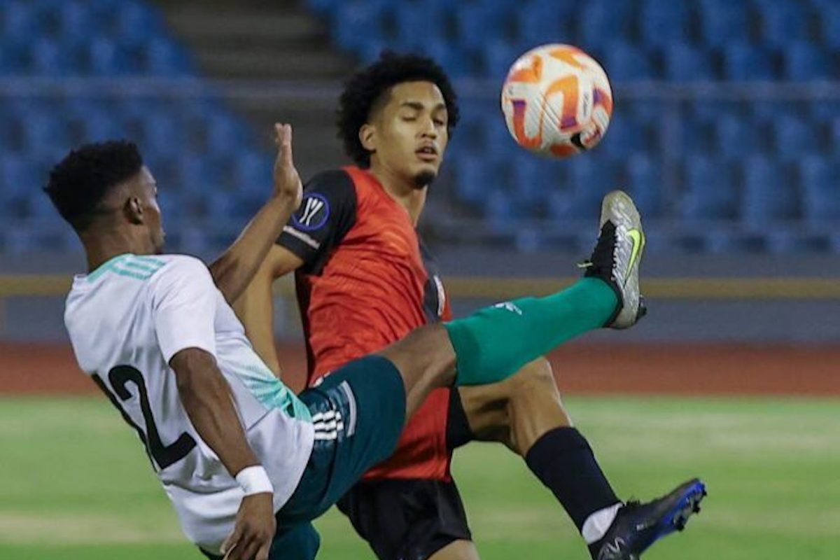 AC PoS Michel Poon-Angeron (R) challenges Prisons FC Jay-son Joseph for the ball during the Trinidad and Tobago Premier Football League match at the Hasely Crawford Stadium, on Friday night, in Port of Spain. AC PoS won 5-1. - Photo by Daniel Prentice