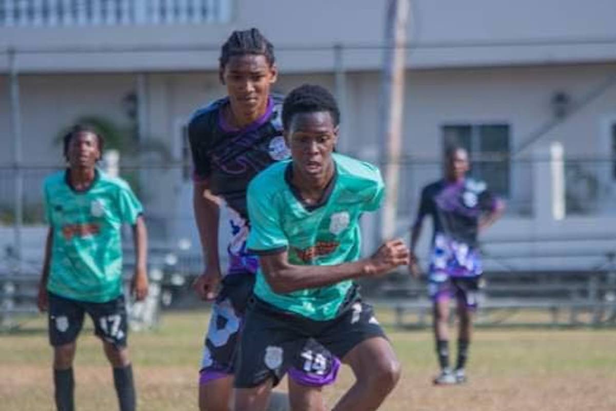 An MIC Matura United player tries to evade his Crown Trace FC opponent during their Central Zone boys’ under-16 clash in the Republic Cup National Youth Football League in UWI, St Augustine on Sunday, March 24th 2024.