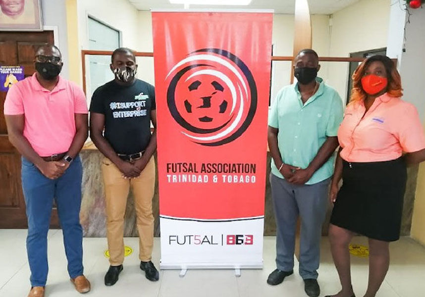 COLLABORATIVE EFFORT: Geoffrey Edwards, Futsal president, from left, Justin Lewis, Dass Trace Youth Empowerment Committee president, Enterprise businessman Sean Regis and Ginelle Small-Cummings, chairman, Jimroy Wyse Committee.