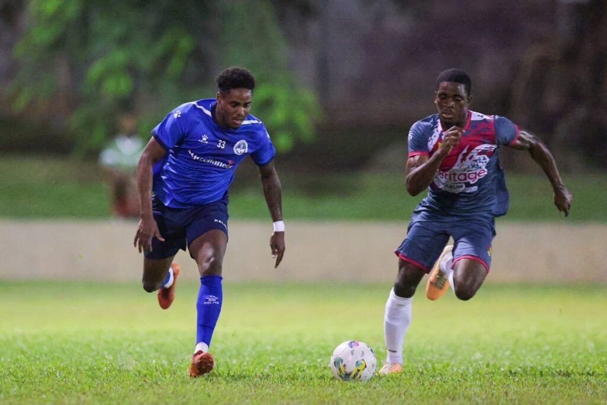 Police FC Joevin Jones (L) goes past Point Fortin Civic’s Justin Cornwall during the T&T Premier Football League match at the Police Barracks on Wednesday January 3rd 2024, in St James. PHOTO BY: Daniel Prentice