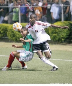 Young Soca Warriors midfielder Kevin Molino, right, shrugs off the challenge of Mexico's Marco De La Mora during their CONCACAF Under- 20 Championship match at the Marvin Lee Stadium. ...Author: AZLAN MOHAMMED (Newsday).