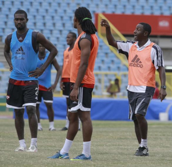 Soca Warriors coach, Russell Latapy, right, gives out instructions to W Connection duo, Matthew Bartholomew, centre, and Clyde Leon during Monday’s national team training session at the Hasely Crawford Stadium, Mucurapo. ...Photo: Anthony Harris.