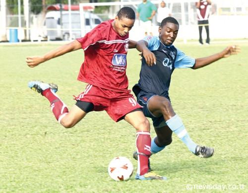 Alvin Jones, left, of Mucurapo East Secondary shoots as Jumaane Cox attempts to block yesterday in the BGTT Secondary Schools North Zone match at Queen's Royal College, St Clair. ...Author: SUREASH CHOLAI