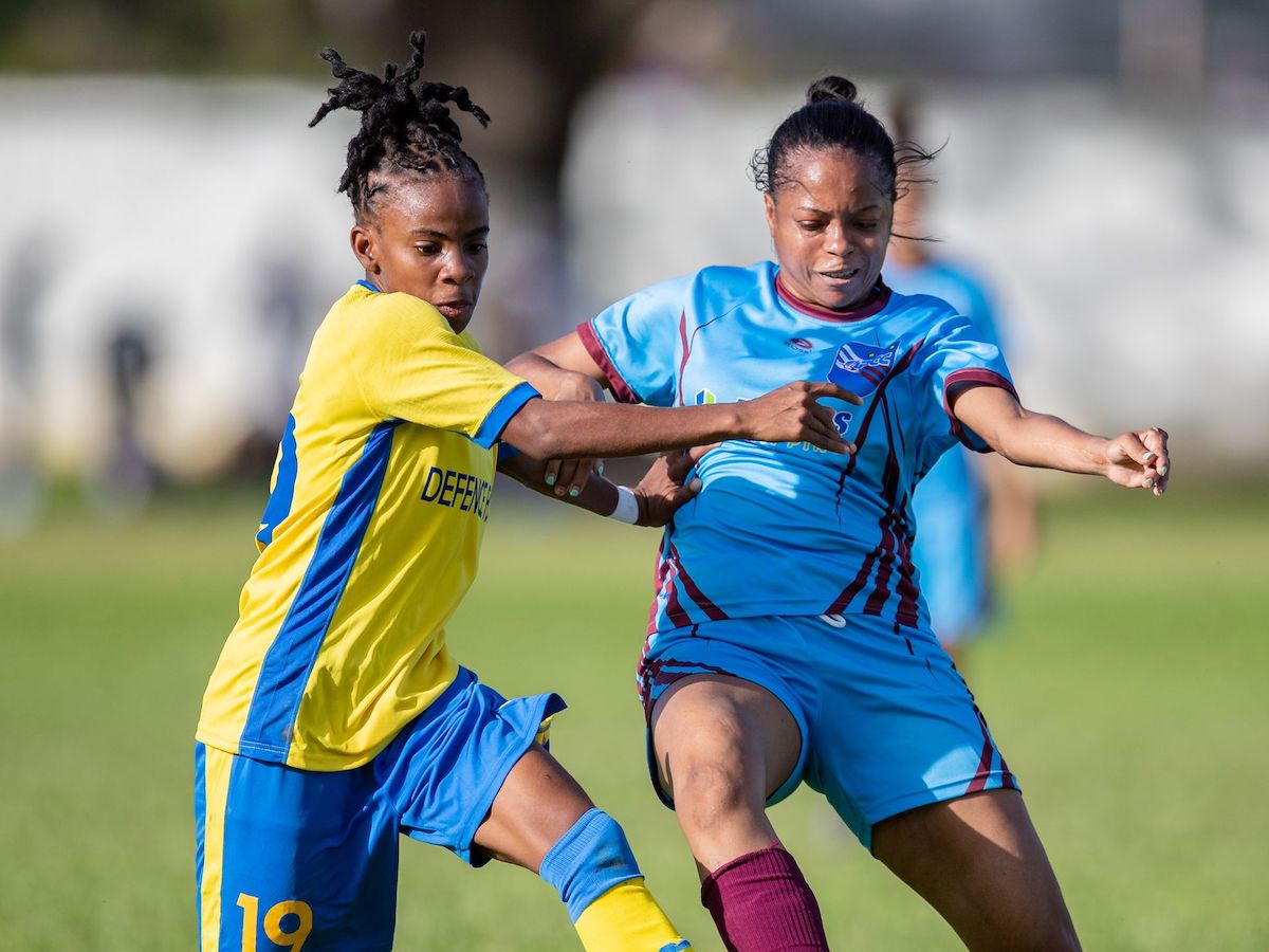 Aaliyah Prince of Defence Force FC women vie for possession with QPCC FC women Anushka Villaruel during a TTWOLF Ascension Tournament match at CIC Grounds in Port-of-Spain on July 30th 2022. The Match ended in a 3-3 draw. PHOTO: Daniel Prentice
