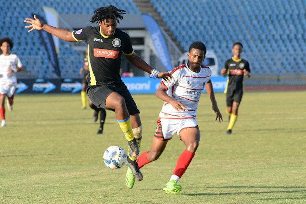Chaguanas North Secondary’s Lee-Vann David, left, traps the ball under pressure from St Anthony’s College’s Jean-Marc Thomas, during a Coca-Cola InterCol quarter-final clash, at the Hasely Crawford Stadium on Tuesday, November 28th 2023. PHOTO BY: Ishmael Salandy