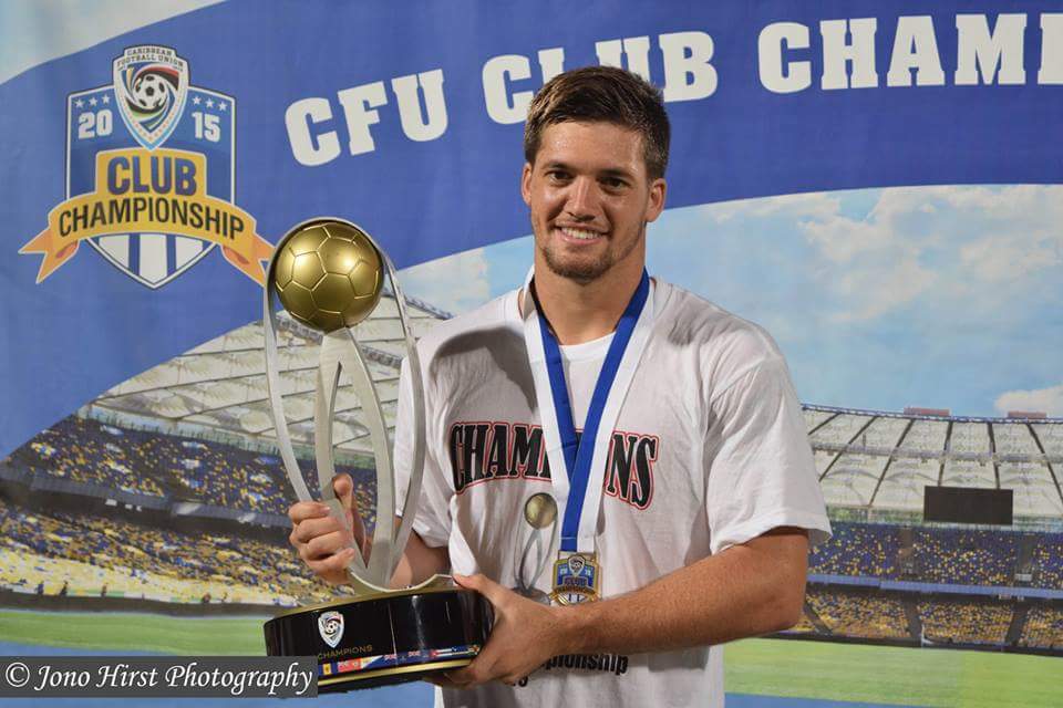Sean de Silva with the 2015 CFU Club Championship Trophy