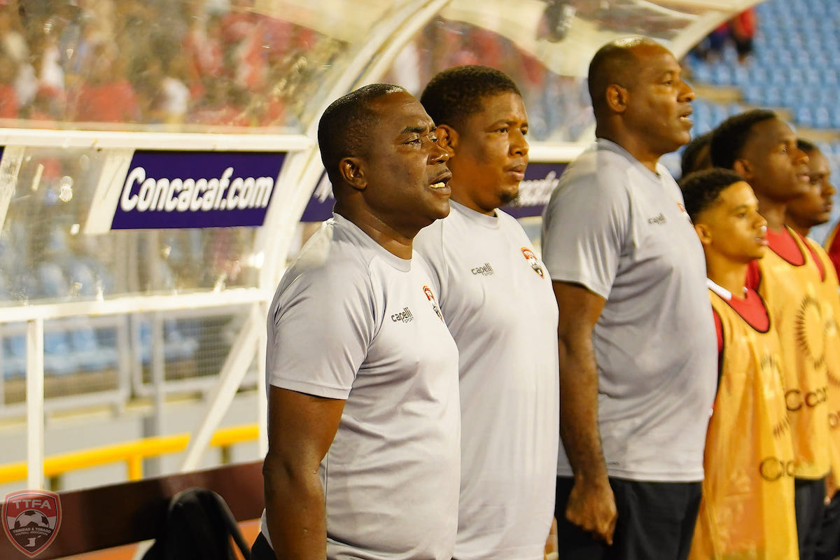 Trinidad and Tobago Head Coach Angus Eve (left) sings his country's national anthem ahead of a Concacaf Nations League quarterfinal match against United States at the Hasely Crawford Stadium, Port of Spain on Monday, November 20th 2023.