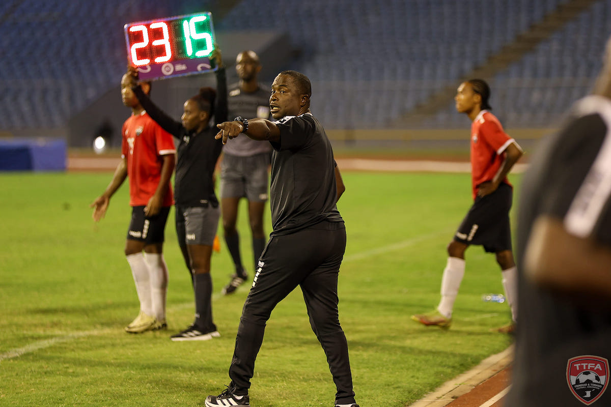 Trinidad and Tobago Head Coach Angus Eve belts out instructions while Lindell Sween (left) and Josiah Wilson (right) are substituted into the game against Guyana at the Hasely Crawford Stadium, Mucurapo on Monday, May 13th 2024.
