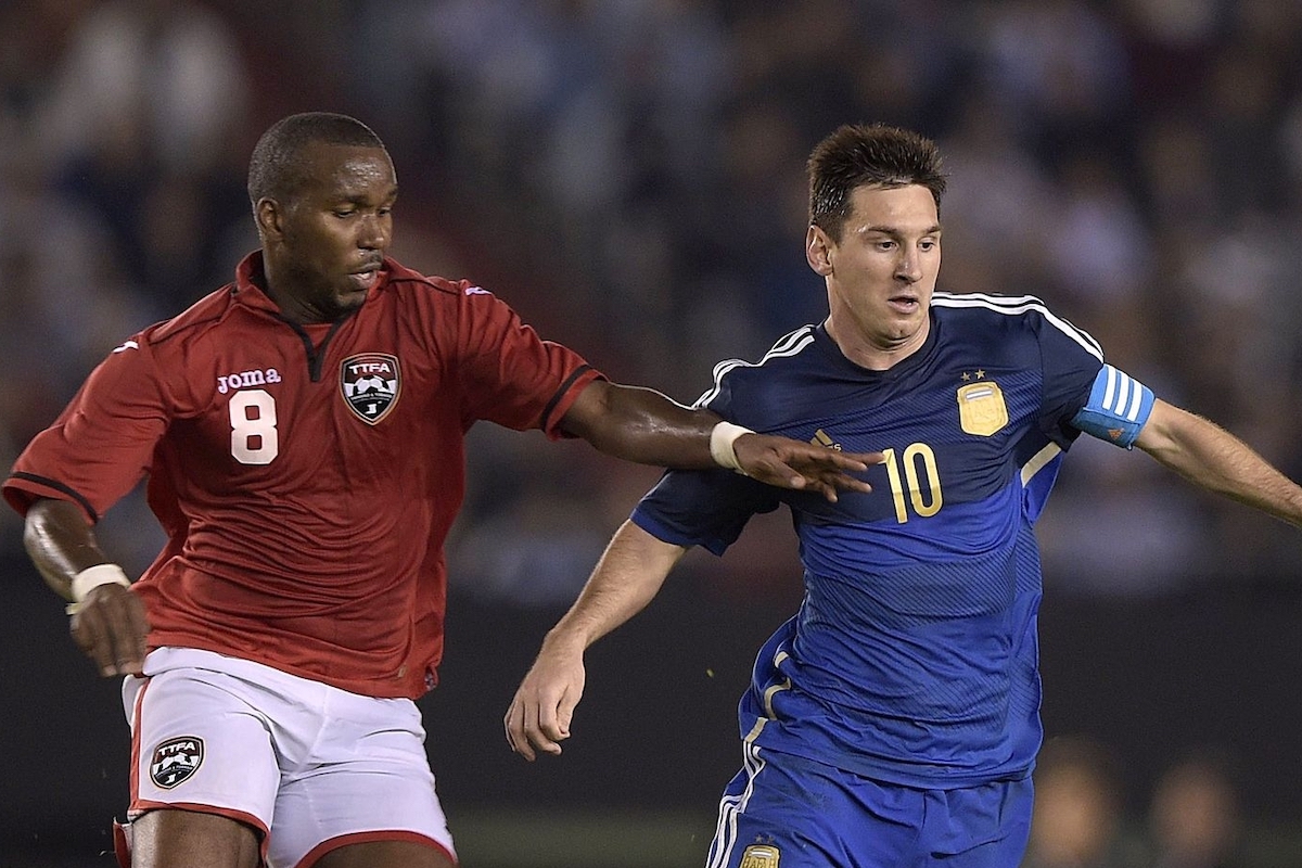 Argentina's forward Lionel Messi (R) vies for tha ball with Trinidad and Tobago's midfielder Khaleem Hyland during a friendly football match at the Monumental stadium in Buenos Aires, Argentina on June 4, 2014. Argentina won 3-0. AFP PHOTO / Juan Mabromata (Photo credit should read JUAN MABROMATA/AFP via Getty Images)