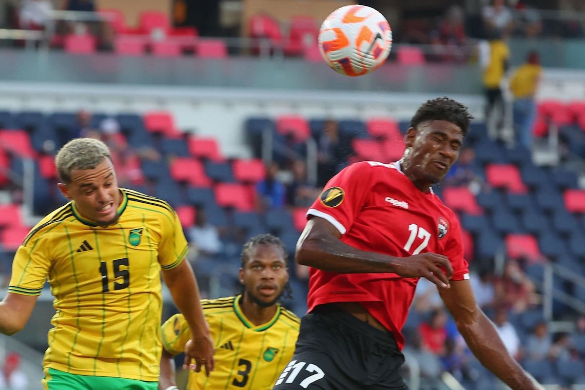 Andre Rampersad #17 of Trinidad & Tobago heads the ball against Joel Latibeaudiere#15of Jamaica in the second half during 2023 CONCACAF Gold Cup at Citypark on June 28, 2023 in St Louis, Missouri. (Photo by Dilip Vishwanat/Getty Images)