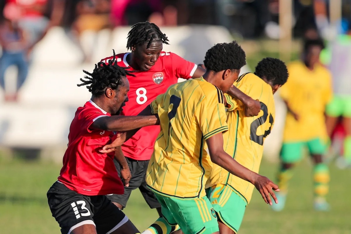 Trinidad and Tobago U-20's Joshua Figaro (#13) and Abayomi George (#8) challenge their opens for the ball during a warm-up match against Jamaica at UTT's O'Meara Campus on Thursday, January 25th 2024.