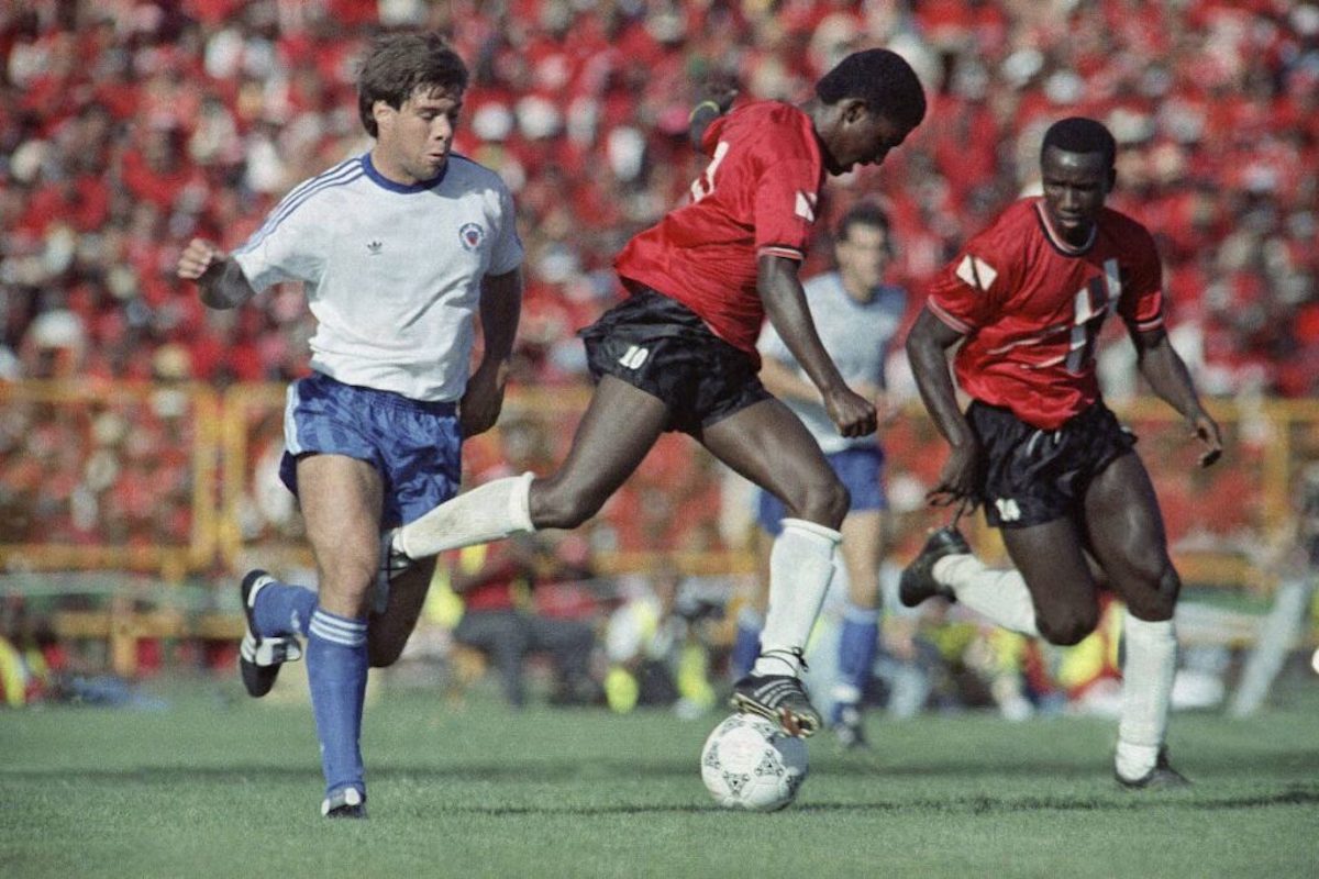 The USA's Paul Caligiuri, left, engages Strike Squad player Russell Latapy in an Italia 1990 World Cup qualifying match at the Hasely Crawford Stadium in Trinidad and Tobago on Sunday, November 19th 1989. It was Caligiuri's 28-yard shot that secured a 1-0 victory and the US' qualification to the World Cup. AP PHOTO - Mark Lennihan
