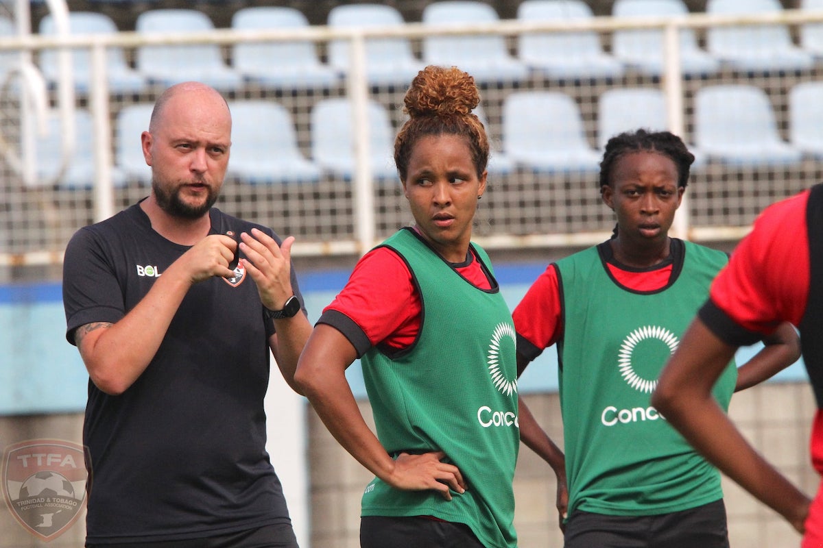 Trinidad and Tobago Women's Head Coach James Thomas and midfielder Maylee Attin-Johnson during a training session at the Ato Boldon Stadium, Couva on Wednesday, September 15th 2021.