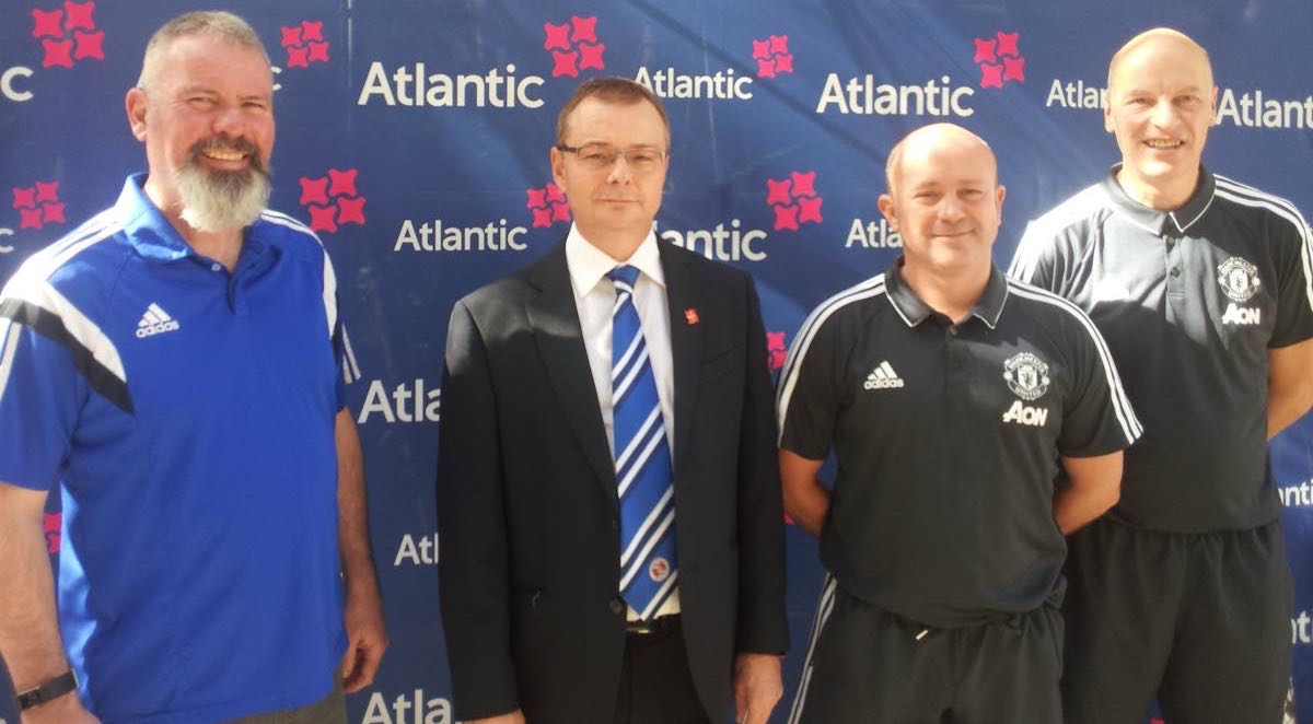 Former Manchester United footballer Brian McClair, left, Atlantic CEO Nigel Darlow, second from left, head coach of Manchester United Football Academy (MUFA) Eamon Mulvey, second from right, and MUFA coach Kevin Ward.