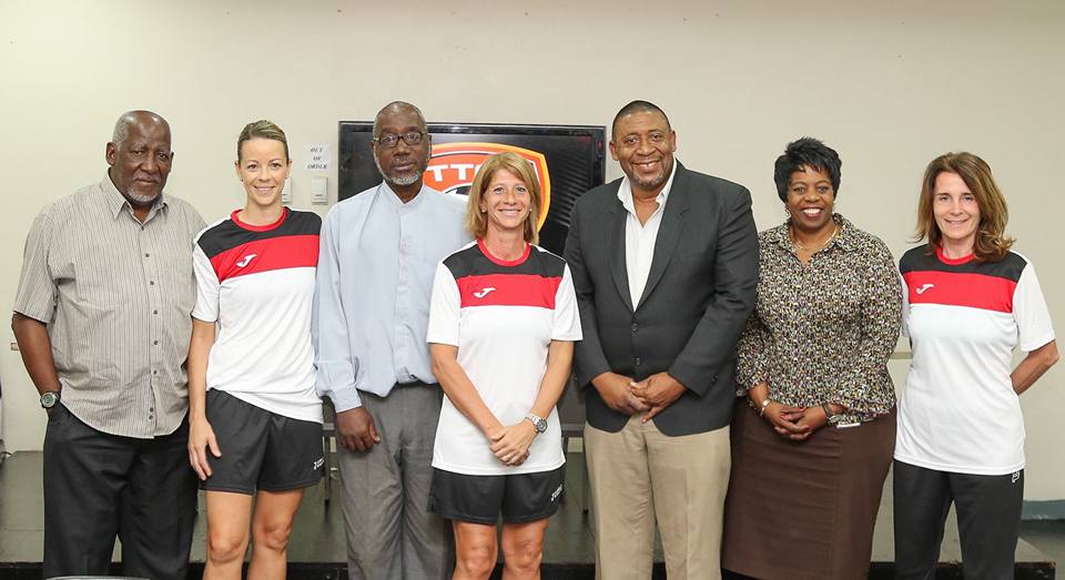 Carolina Morace (centre) stands next to TTFA President David John-Williams, Vice President Ewing Davis (third from left), Vice President Joanne Salazar (second from right), Assistant Coach Elisabetta Bavagnoli (far right), TTFA Technical Director Muhammad Isa (far left) and Assistant coach Nicola Williams (second from left) following Wednesday’s Press Conference at the Ato Boldon Stadium Press Conference Room. Photo by Sean Morrison.