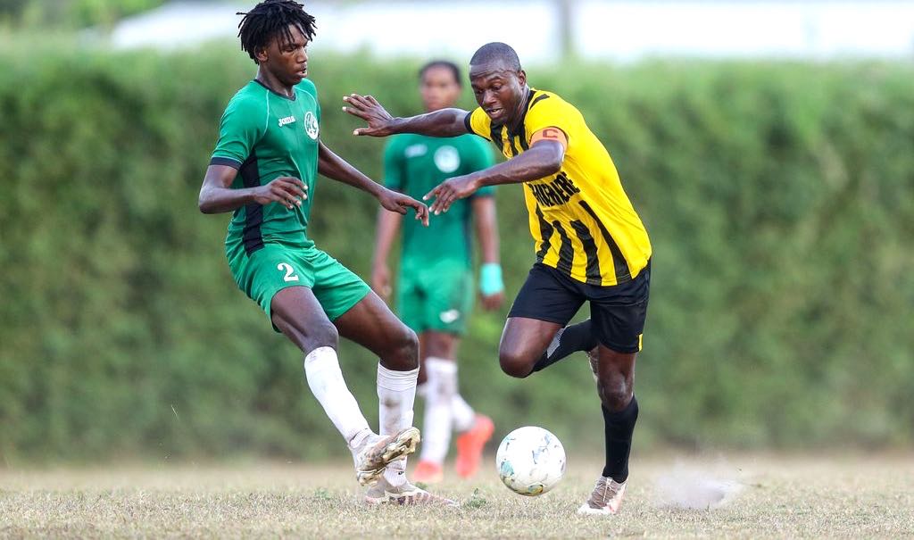 Central FC captain Keron Cummings, right, gets past W Connection Joash Baird (No 2) during the T&T Premier League match at the Mahaica Sporting Complex in Point Fortin, yesterday. Cummings scored a penalty in Central FC’s 2-0 win. (Photo by Daniel Prentice) .... Daniel Prentice