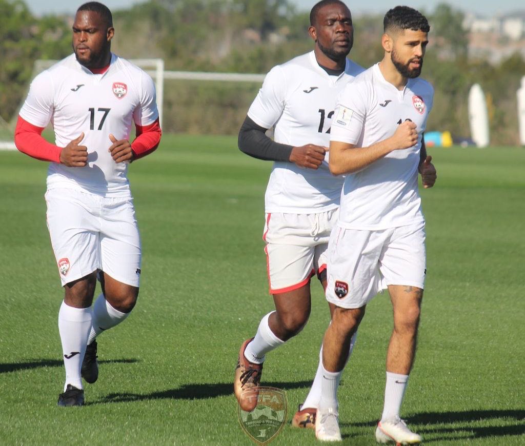 Canadian-based midfielder and full-back Federico Pena, right, lead the team in a warm-up session on Saturday at the team’s base in Orlando, Florida, USA. T&T will face the United States in an international friendly at Exploria Stadium in Orlando on Sunday from 8:30 pm TT Time. ...Courtesy TTFA
