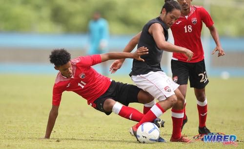 Photo: Attacker Gary Griffith III (left) tackles midfielder Gabriel Nanton during Men’s National Senior Team training on 17 July 2020 at the Ato Boldon Stadium, Couva. (Copyright Allan V Crane/CA-Images/Wired868)