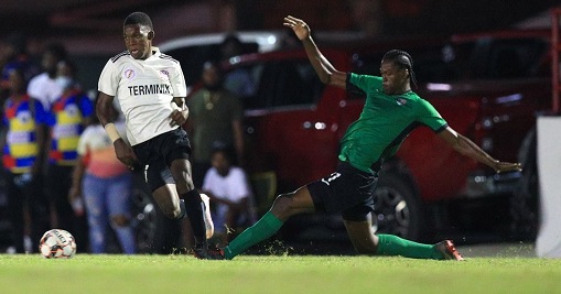 La Horquetta Rangers' winger Raihim Thomas, left, skips past the challenge from Real West Fort defender Haile Farrell during the Ascension Tournament at the Phase II recreation ground on Friday in La Horquetta. Rangers won 5-2.