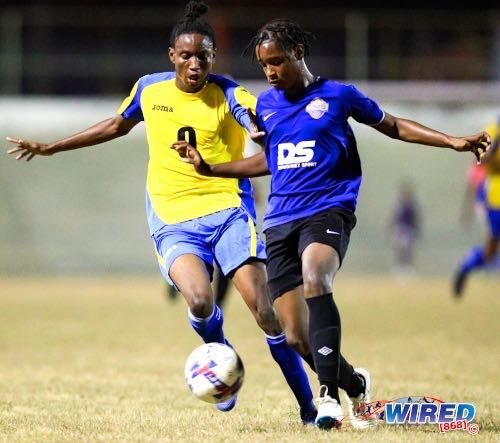 Photo: Referee Oswald Samuel (centre) signals for a free kick against SMS defender Shaheim O’Brian (left, standing) during NLCL U-19 Community Cup action against Malabar Young Stars at the Arima Velodrome on 5 May 2022. (Copyright Daniel Prentice/ Wired868)