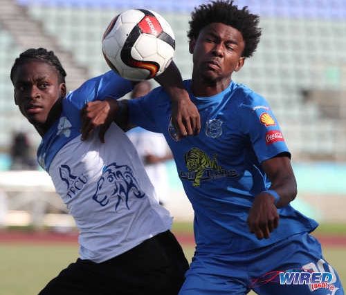 Photo: Naparima College forward Seon Shippley (right) and Presentation College defender Justin Cornwall tussle for the ball during the South Zone Intercol final at the Mannie Ramjohn Stadium on 26 November 2018. ...(Copyright Kerlon Orr/CA-Images/Wired868)