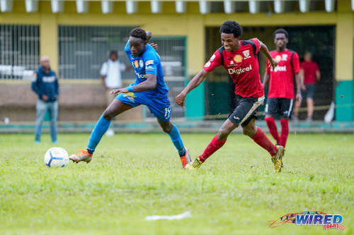 Photo: Naparima College forward Isa Bramble (left) runs at the St Anthony’s College defence during SSFL action at Westmoorings on 9 October 2019. (Copyright Daniel Prentice/CA-Images/Wired868)