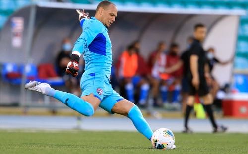 Photo: Trinidad and Tobago goalkeeper Nicklas Frenderup takes a goalkick during World Cup qualifying action in Mayaguez on 28 March 2021. (via TTFA Media)