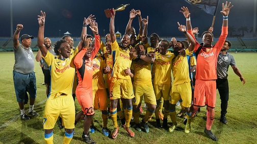 Presentation College players and coaching staff celebrate their South Zone Coca Cola Intercol win over Naparima College at the Mannie Ramjohn Stadium in Marabella yesterday. Presentation won 4-3 on penalties after a 1-1 draw. ...Daniel K. Prentice/CA-images
