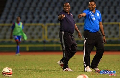Photo: Morvant Caledonia United co-founder and head coach Jamaal Shabazz (left) and then assistant coach Rajesh Latchoo enjoy a good day at the office during the 2013/14 Pro League season. (Courtesy Allan V Crane/Wired868)