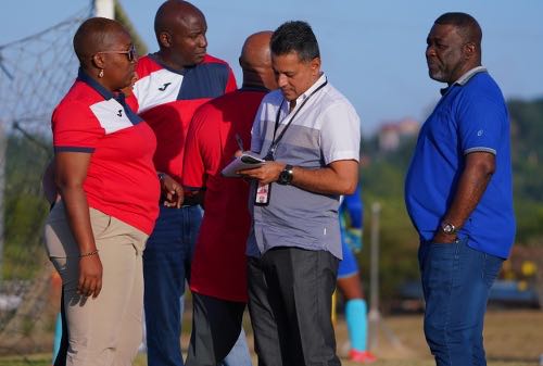 Photo: TTFA president William Wallace (far right), general secretary Ramesh Ramdhan (second from right) and technical director Dion La Foucade (second from left) talk to Women’s U-20 Team manager Maylee Attin-Johnson during practice at the Ato Boldon Stadium training field in Couva on 7 February 2020. (Copyright Daniel Prentice/Wired868)