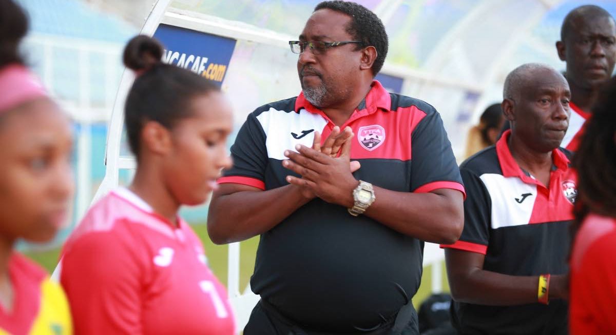 National women’s football coach Jamaal Shabazz, centre, is keen to see this country be the premier force in the Caribbean again.
