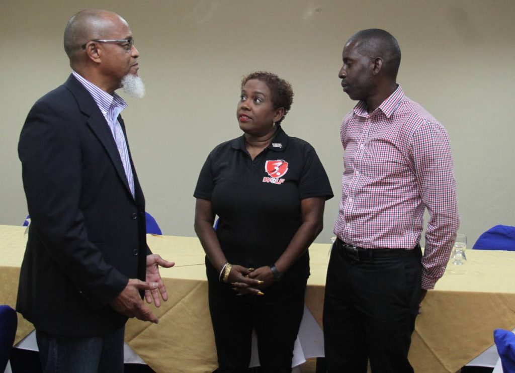 President of the TT Super League and board member of the TT Football Association (TTFA) Keith Look Loy, left, chats with president of the TT Women's League Football (WoLF) Susan Joseph-Warrick and board member of the Northern Football Association secretary Rayshawn Mars,right, at a press conference , held at the Hotel Normandie, yesterday. - AYANNA KINSALE