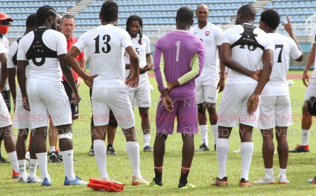 Trinidad and Tobago men's football coach Terry Fenwick chats with players during a training session on Wednesday at the Ato Boldon Stadium, Couva. PHOTO BY MARVIN HAMILTON -