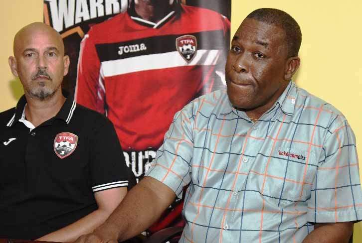 SHOP TALK: William Wallace, the Trinidad and Tobago senior national team and operations manager, right, and national head coach Stephen Hart speak at a press conference yesterday at the office of the Trinidad and Tobago Football Association (TTFA), Wrightson Road, Port of Spain. --Photo: Anisto Alves.