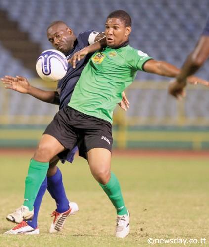  San Juan Jabloteh's goal scorer Jean-Luc Rochford battles for the ball against Police FC's captain Todd Ryan in the second half of Round 2 Matchday 4 of the Digicel T&T Pro-League at the Hasely Crawford Stadium. Police FC won 2-1 and moved up to 3rd in the table.