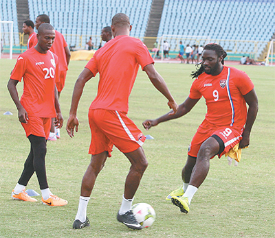 Soca Warriors captain, Kenwyne Jones, right, closes in on Ataullah Guerra during the national team’s training session at the Hasely Crawford Stadium, Mucurapo on Tuesday night in preparation for their friendly international against Curacao at the Stadion Ergilio Hato, Willemstad, Curacao tomorrow. Photo: Anthony Harris