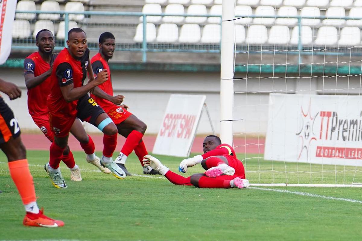 AC Port of Spain's Jamal Charles (#9) celebrates with teammates after scoring against Club Sando during their T&T Premier Football League match at Larry Gomes Stadium, Malabar on Saturday, May 11th 2024.