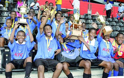 Arima Boys RC team celebrate after winning the Boys Division final of the Atlantic LNG National Primary Schools Football League at the Hasely Crawford Stadium in Mucurapo, yesterday. Arima defeated Santa Flora 4-2. Photo: Anthony Harris